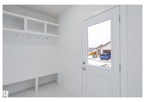 Mudroom featuring light marble finish floors and baseboards - 231 25 Street Sw, Edmonton, AB - Indoor