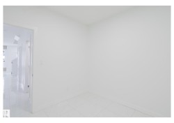 Unfurnished room featuring baseboards - 