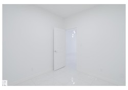 Unfurnished room featuring baseboards - 