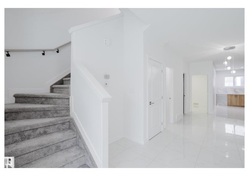 Staircase featuring marble finish floors - 231 25 Street Sw, Edmonton, AB - Indoor Photo Showing Other Room