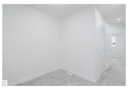 Unfurnished room with light carpet and recessed lighting - 231 25 Street Sw, Edmonton, AB - Indoor Photo Showing Other Room