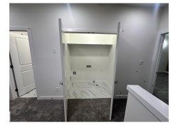 Laundry area featuring light marble finish flooring, hookup for an electric dryer, and gas dryer hookup - 