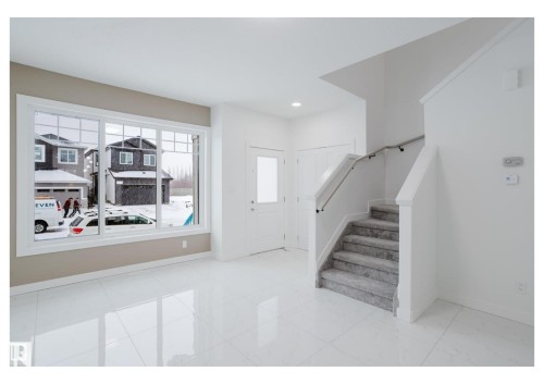 Foyer entrance with stairs and recessed lighting - 231 25 Street Sw, Edmonton, AB - Indoor Photo Showing Other Room