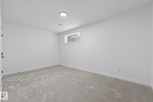 Unfurnished room with baseboards and light colored carpet - 3318 Chickadee Drive, Edmonton, AB - Indoor Photo Showing Other Room
