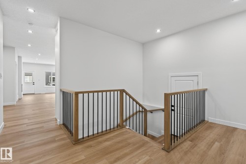 Stairway featuring wood finished floors and recessed lighting - 3318 Chickadee Drive, Edmonton, AB - Indoor Photo Showing Other Room