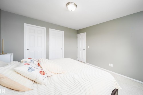 Bedroom with carpet and a closet - 1179 Oakland Drive, Devon, AB - Indoor Photo Showing Bedroom