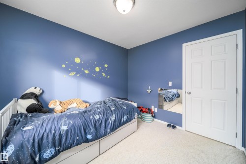 Bedroom with carpet and baseboards - 1179 Oakland Drive, Devon, AB - Indoor Photo Showing Bedroom