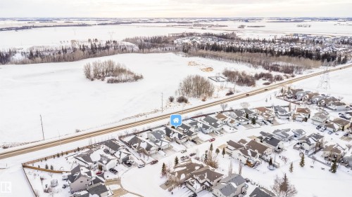 Snowy aerial view with a residential view - 1179 Oakland Drive, Devon, AB - Outdoor With View
