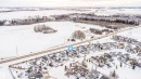 Snowy aerial view with a residential view - 1179 Oakland Drive, Devon, AB  - Outdoor With View 