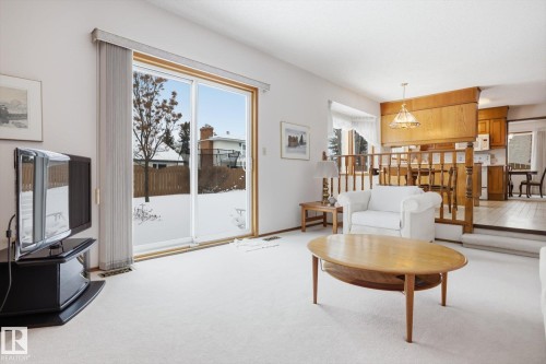 Living room featuring light carpet and baseboards - 65 Lorne Crescent, St. Albert, AB - Indoor Photo Showing Living Room