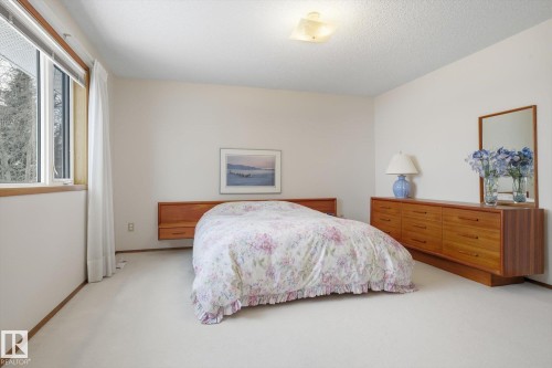 Bedroom with light colored carpet and a textured ceiling - 65 Lorne Crescent, St. Albert, AB - Indoor Photo Showing Bedroom