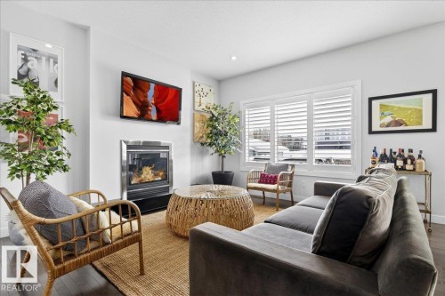 21937 94A Avenue, Edmonton, AB - Indoor Photo Showing Living Room With Fireplace