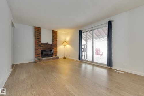 8 Harrison Drive, Edmonton, AB - Indoor Photo Showing Living Room With Fireplace