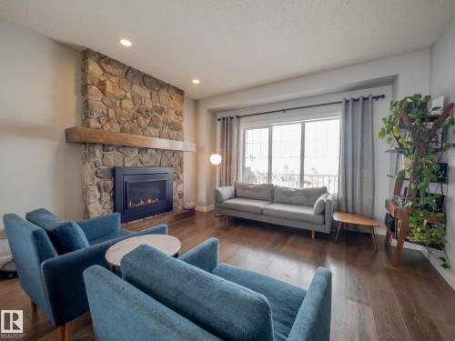 289 Hawks Ridge Boulevard, Edmonton, AB - Indoor Photo Showing Living Room With Fireplace
