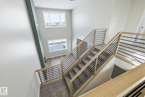 Stairway featuring a high ceiling and carpet floors - 28 Harley Way, Spruce Grove, AB - Indoor Photo Showing Other Room