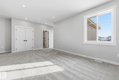 Unfurnished bedroom featuring carpet, a closet, and recessed lighting - 28 Harley Way, Spruce Grove, AB - Indoor Photo Showing Other Room