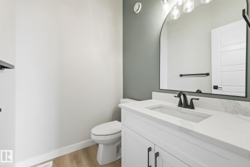 Bathroom featuring vanity and light wood finished floors - 28 Harley Way, Spruce Grove, AB - Indoor Photo Showing Bathroom