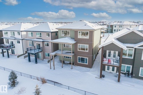 Snow covered house with a residential view - 28 Harley Way, Spruce Grove, AB - Outdoor