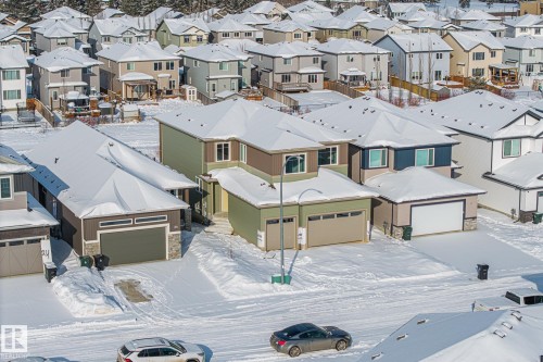 Snowy aerial view with a residential view - 28 Harley Way, Spruce Grove, AB - Outdoor With Facade