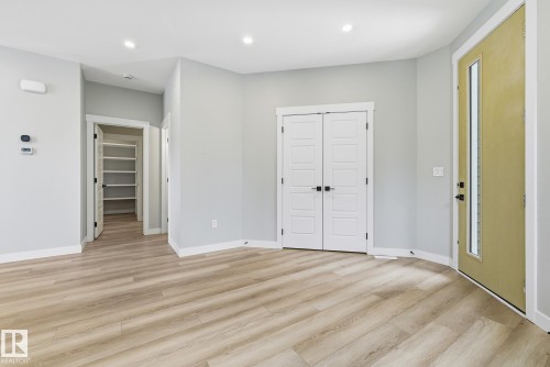 Foyer entrance featuring light wood-style flooring and recessed lighting - 28 Harley Way, Spruce Grove, AB - Indoor Photo Showing Other Room