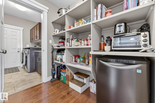 Pantry featuring washing machine and clothes dryer - 21 Dittrich, Fort Saskatchewan, AB - Indoor