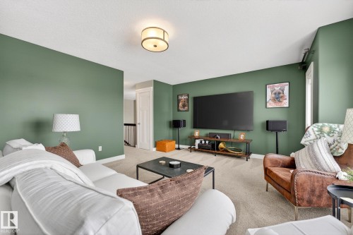 Living room featuring carpet and baseboards - 21 Dittrich, Fort Saskatchewan, AB - Indoor Photo Showing Living Room