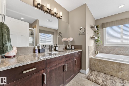 Bathroom featuring vanity, a bath, a shower stall, and recessed lighting - 21 Dittrich, Fort Saskatchewan, AB - Indoor Photo Showing Bathroom