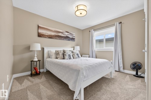 Bedroom with light colored carpet - 21 Dittrich, Fort Saskatchewan, AB - Indoor Photo Showing Bedroom