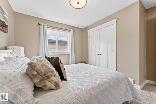 Bedroom featuring a closet and carpet floors - 21 Dittrich, Fort Saskatchewan, AB - Indoor Photo Showing Bedroom