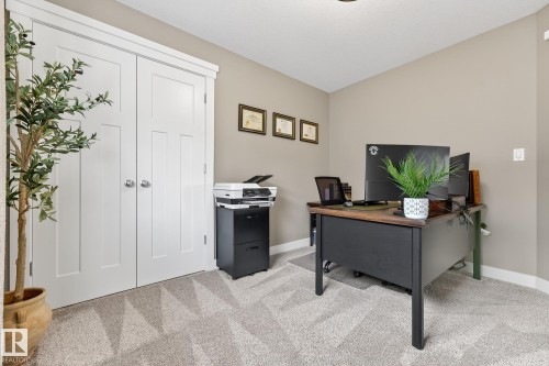Office space featuring light colored carpet and lofted ceiling - 21 Dittrich, Fort Saskatchewan, AB - Indoor