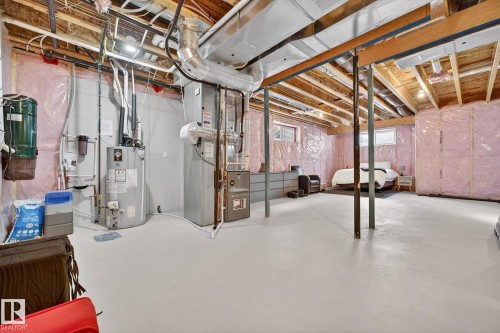 Basement featuring heating unit and gas water heater - 21 Dittrich, Fort Saskatchewan, AB - Indoor Photo Showing Basement