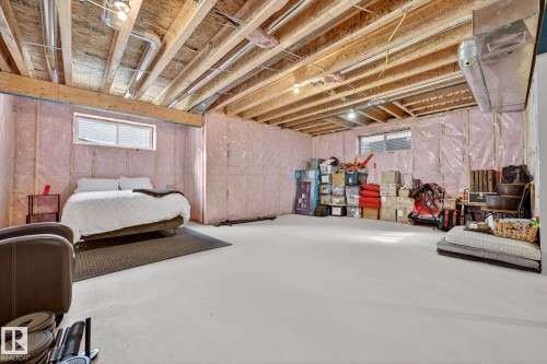 Bedroom with multiple windows and concrete flooring - 21 Dittrich, Fort Saskatchewan, AB - Indoor Photo Showing Basement