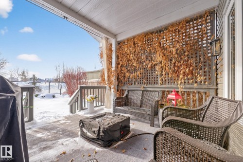 Snow covered deck with a grill - 21 Dittrich, Fort Saskatchewan, AB - Outdoor With Deck Patio Veranda With Exterior