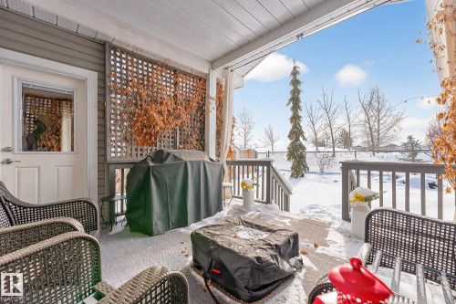 Snow covered deck featuring area for grilling - 21 Dittrich, Fort Saskatchewan, AB - Outdoor With Deck Patio Veranda With Exterior