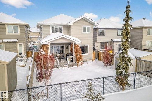 Traditional-style home featuring a fenced backyard and a residential view - 21 Dittrich, Fort Saskatchewan, AB - Outdoor With Deck Patio Veranda