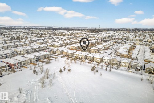 Yard covered in snow with a residential view - 21 Dittrich, Fort Saskatchewan, AB - Outdoor With View