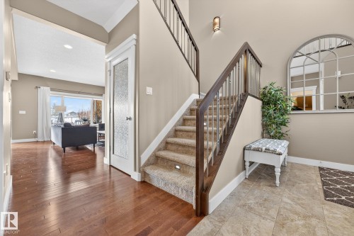 Stairway with wood-type flooring and recessed lighting - 21 Dittrich, Fort Saskatchewan, AB - Indoor Photo Showing Other Room