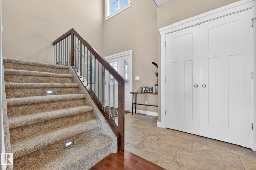 Foyer with plenty of natural light, a high ceiling, and wood finished floors - 21 Dittrich, Fort Saskatchewan, AB - Indoor Photo Showing Other Room
