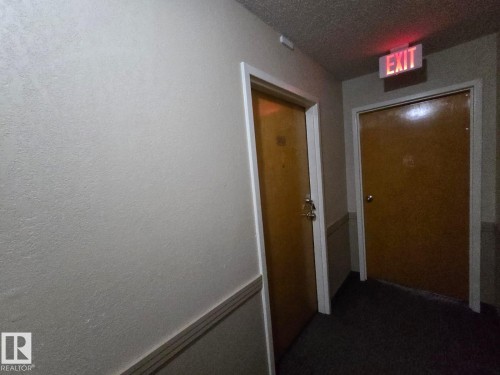 Corridor with a textured ceiling - 302 49 Akins Drive, St. Albert, AB - Indoor Photo Showing Other Room