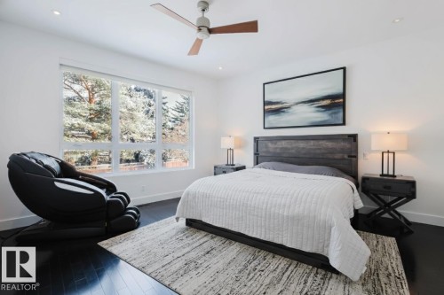 Bedroom featuring wood finished floors, a ceiling fan, and recessed lighting - 6307 125 Street, Edmonton, AB - Indoor Photo Showing Bedroom