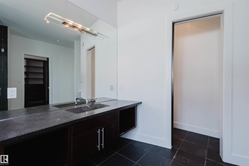 Bathroom featuring vanity and a spacious closet - 6307 125 Street, Edmonton, AB - Indoor
