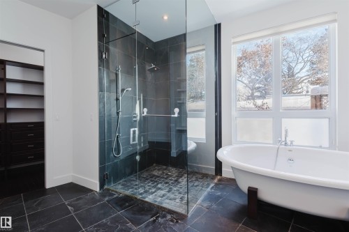 Bathroom with a soaking tub and a stall shower - 6307 125 Street, Edmonton, AB - Indoor Photo Showing Bathroom