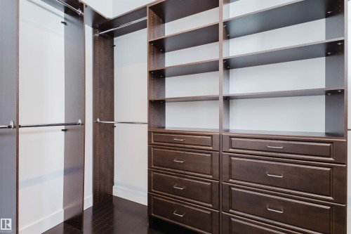 Walk in closet with dark wood finished floors - 6307 125 Street, Edmonton, AB - Indoor Photo Showing Other Room