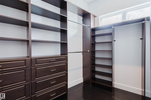 Walk in closet with dark wood-style floors - 6307 125 Street, Edmonton, AB - Indoor Photo Showing Other Room