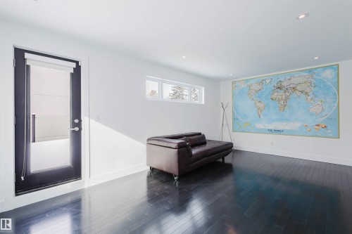 Sitting room with dark wood finished floors and recessed lighting - 6307 125 Street, Edmonton, AB - Indoor