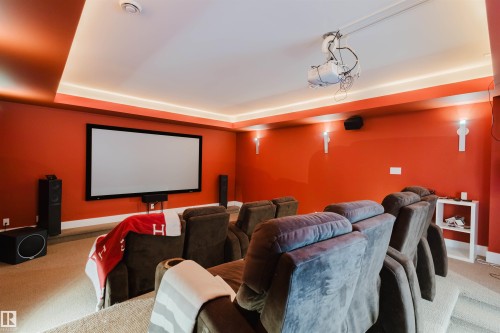 Home theater featuring carpet flooring and a tray ceiling - 6307 125 Street, Edmonton, AB - Indoor Photo Showing Other Room