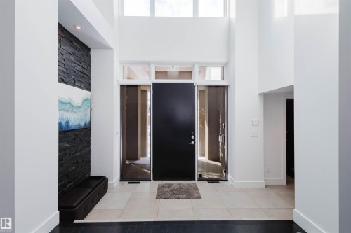 Tiled foyer with a high ceiling and baseboards - 6307 125 Street, Edmonton, AB - Indoor Photo Showing Other Room