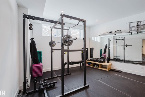 Exercise room featuring dark rubber floors and recessed lighting - 6307 125 Street, Edmonton, AB - Indoor Photo Showing Gym Room