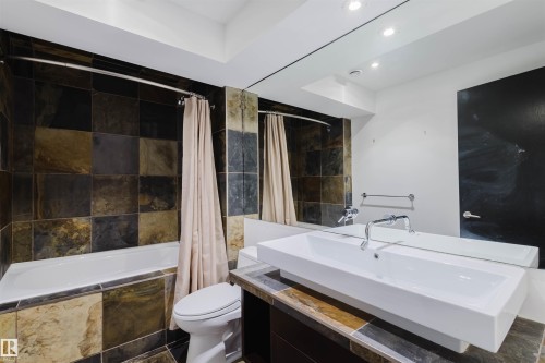 Full bath with vanity, tiled shower / bath combo, and recessed lighting - 6307 125 Street, Edmonton, AB - Indoor Photo Showing Bathroom