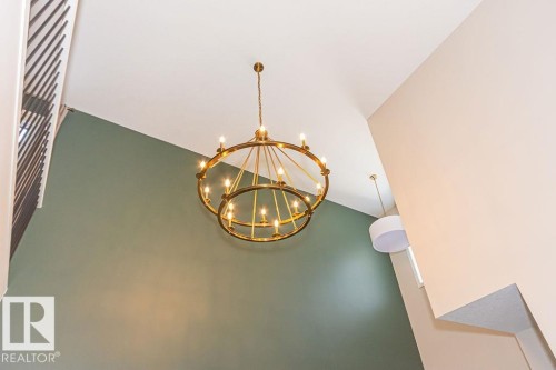 Detailed view of a chandelier - 3128 13 Avenue, Edmonton, AB - Indoor Photo Showing Other Room